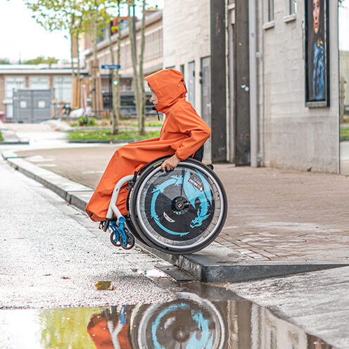 - Raincape junior : Cape imperméable pour fauteuil roulant